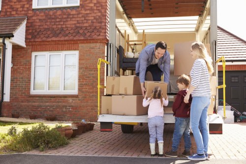 Local moving team handling boxes and household items in Kingsbury
