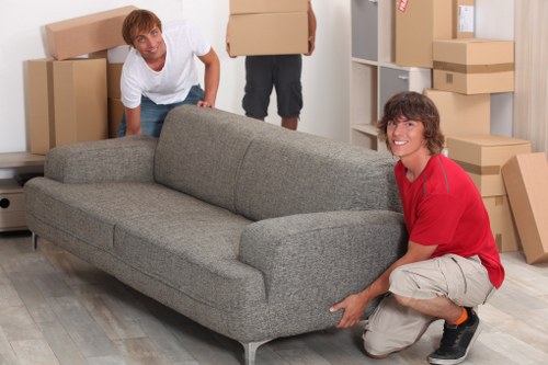 Furniture being carried carefully through a property during a local move